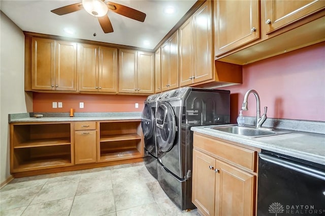 washroom featuring washing machine and dryer, ceiling fan, and sink