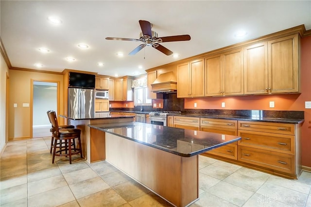 kitchen featuring a center island, stainless steel appliances, premium range hood, and ceiling fan