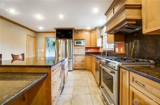 kitchen with dark stone counters, crown molding, light tile patterned flooring, custom range hood, and stainless steel appliances