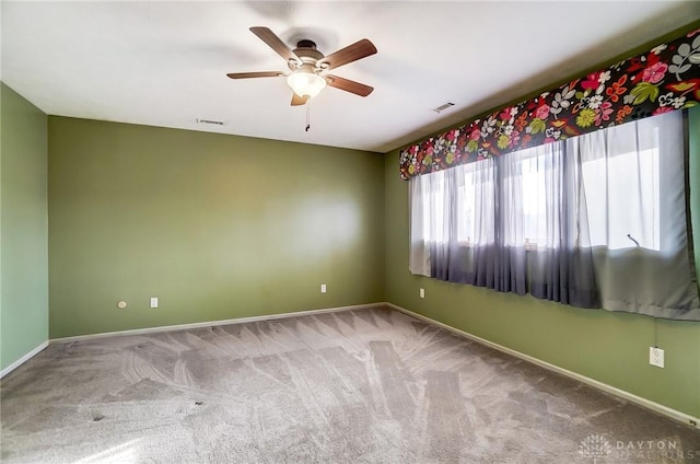 unfurnished room with carpet and ceiling fan