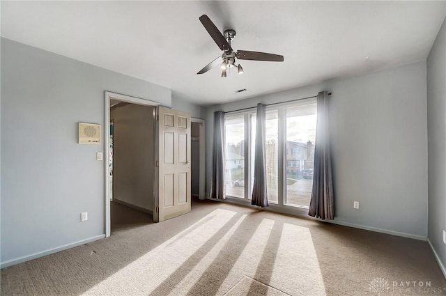 unfurnished bedroom featuring ceiling fan, access to exterior, and carpet floors