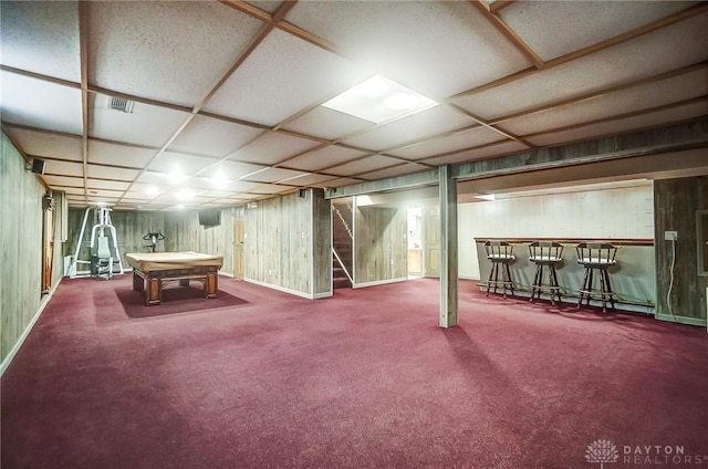 playroom with carpet, bar, wood walls, and billiards