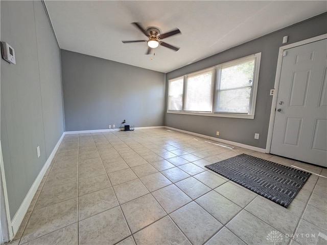 foyer with ceiling fan and light tile patterned floors