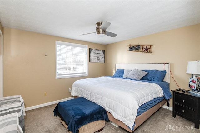 bedroom with light colored carpet and ceiling fan