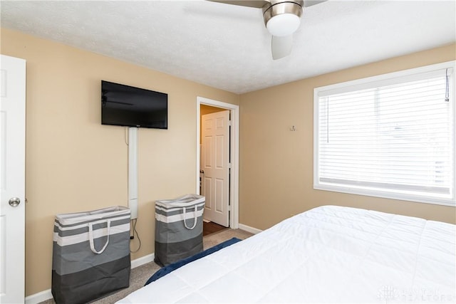 bedroom with carpet flooring, ceiling fan, and multiple windows