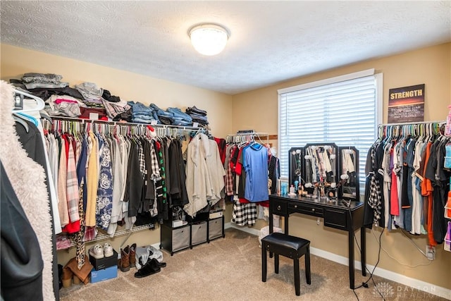 spacious closet featuring carpet flooring