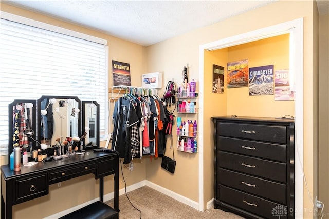 walk in closet featuring carpet floors