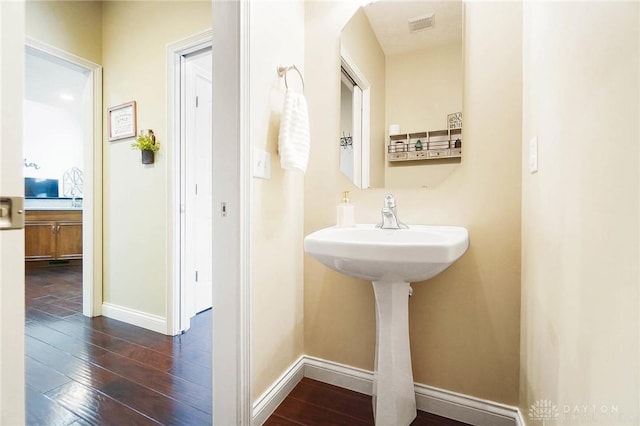 bathroom with wood-type flooring