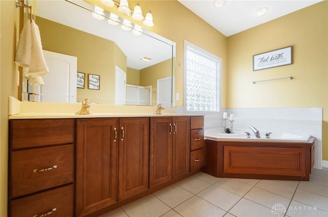 bathroom featuring vanity, separate shower and tub, and tile patterned floors