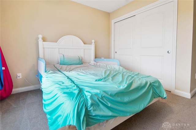 carpeted bedroom featuring a closet