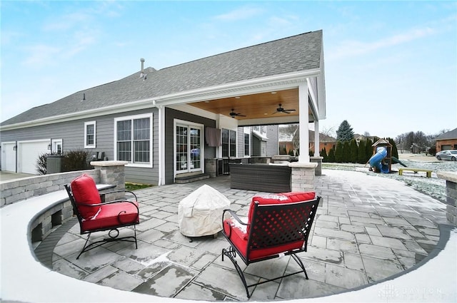 rear view of property featuring an outdoor living space, a patio, and ceiling fan