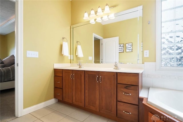 ensuite bathroom featuring double vanity, ensuite bathroom, a sink, tile patterned flooring, and a bath