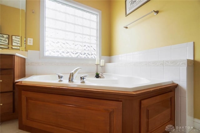 full bath featuring tile walls and a bath