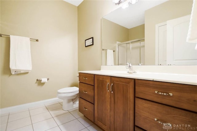 full bath with a stall shower, baseboards, toilet, tile patterned floors, and vanity