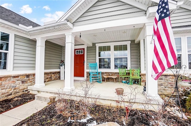 property entrance featuring covered porch