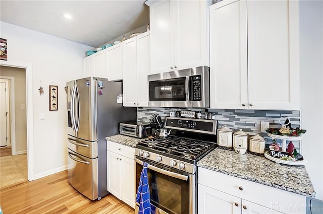 kitchen with white cabinets and stainless steel appliances