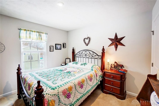 bedroom featuring light carpet