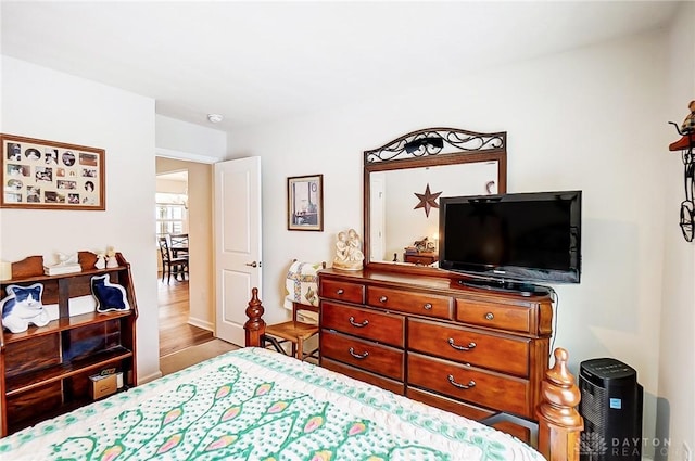 bedroom with wood-type flooring