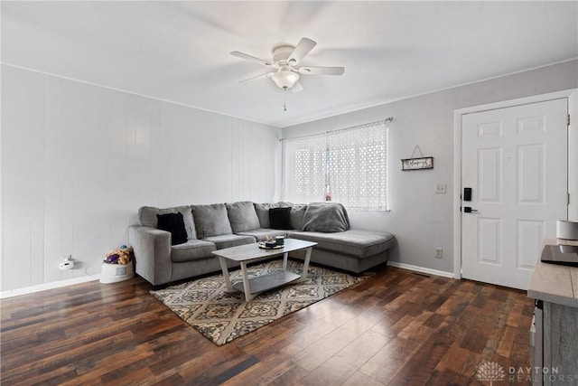 living room with ceiling fan and dark wood-type flooring