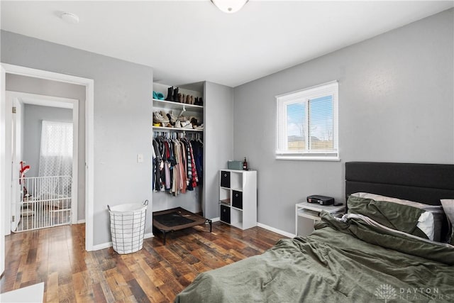 bedroom featuring dark hardwood / wood-style flooring and a closet