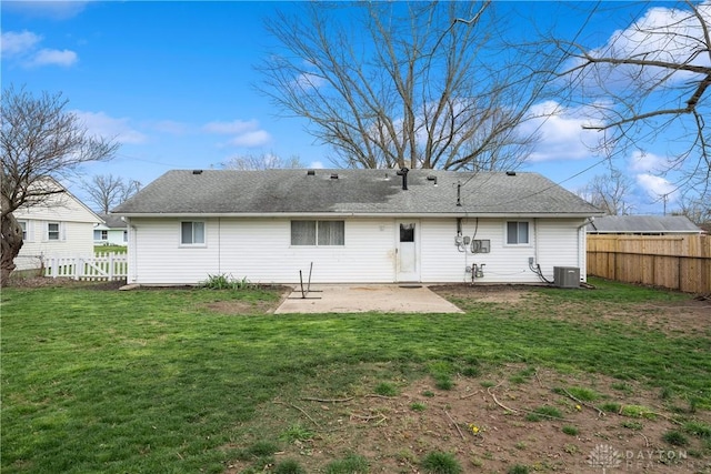 back of house with a yard, a patio area, and central air condition unit