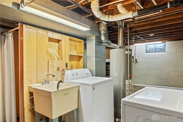 washroom with washer / dryer, sink, and water heater