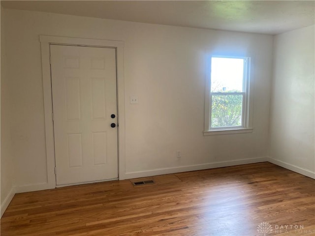 foyer entrance with hardwood / wood-style floors