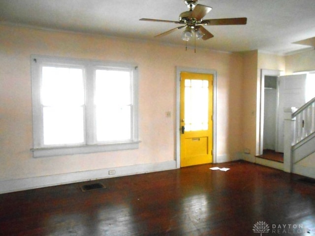 interior space featuring ceiling fan and dark wood-type flooring