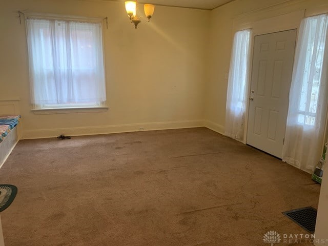 entrance foyer with carpet floors