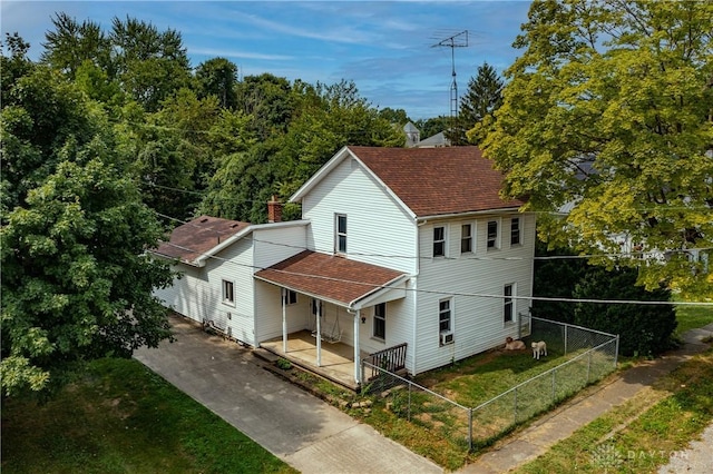 back of house with a yard