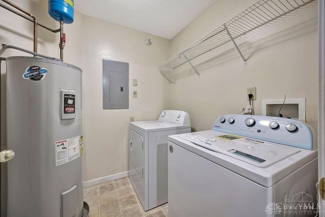 washroom featuring separate washer and dryer, a textured ceiling, electric panel, and water heater