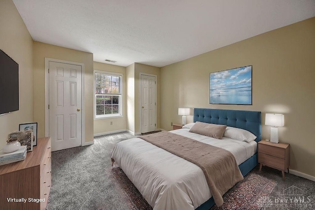 bedroom featuring dark colored carpet