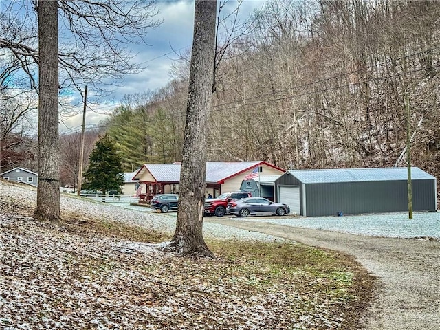 exterior space featuring an outbuilding and a garage