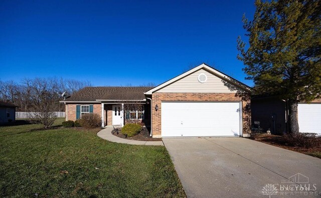 single story home with a front yard and a garage