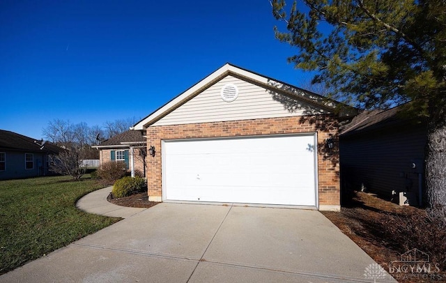 single story home with an attached garage, a front yard, concrete driveway, and brick siding