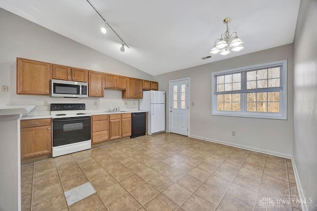 kitchen with black dishwasher, electric stove, stainless steel microwave, visible vents, and freestanding refrigerator