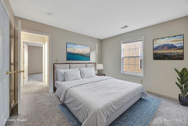 bedroom featuring visible vents, baseboards, and carpet flooring