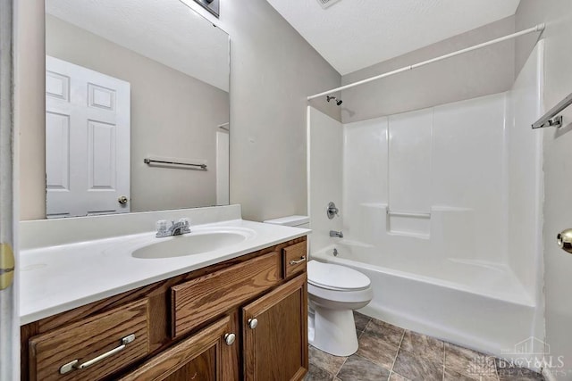 bathroom with shower / washtub combination, vanity, and toilet