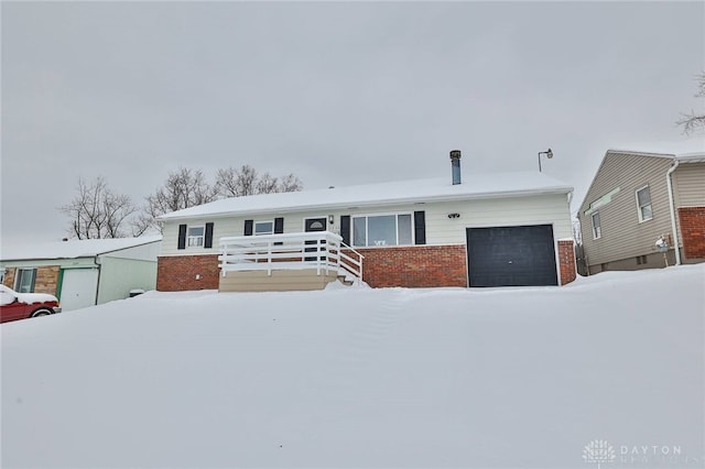 view of front of property with a garage and a deck