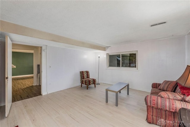 sitting room featuring light wood-type flooring