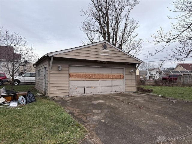 garage featuring a yard