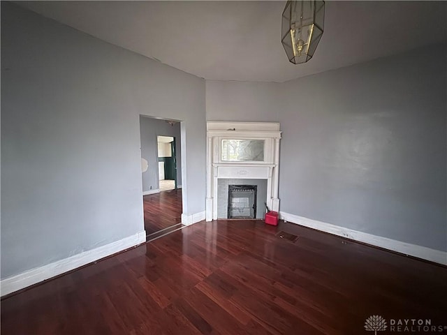 unfurnished living room with hardwood / wood-style flooring