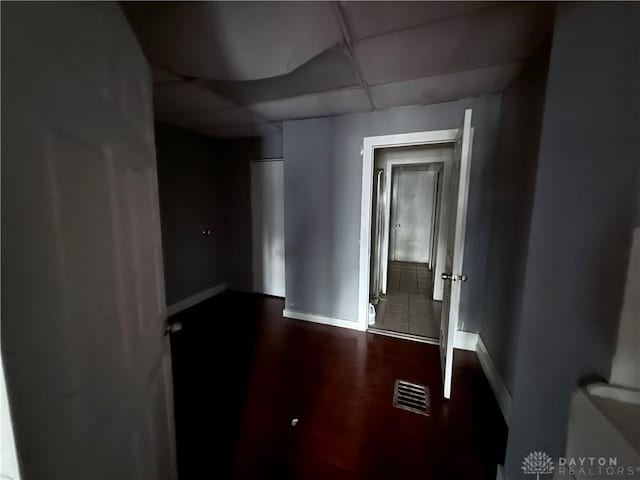 unfurnished room featuring a paneled ceiling