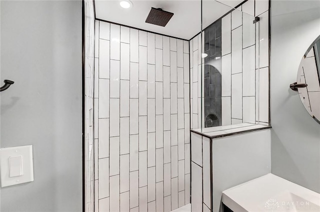 bathroom with a tile shower