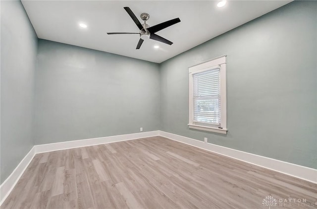 empty room with light wood-type flooring and ceiling fan