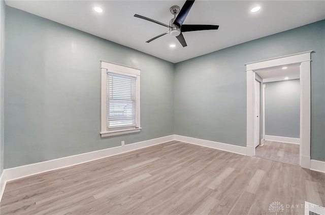 spare room featuring ceiling fan and light hardwood / wood-style flooring