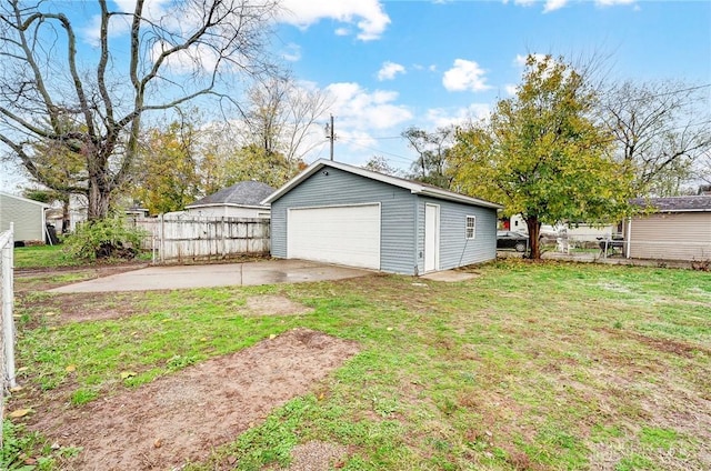 garage featuring a lawn