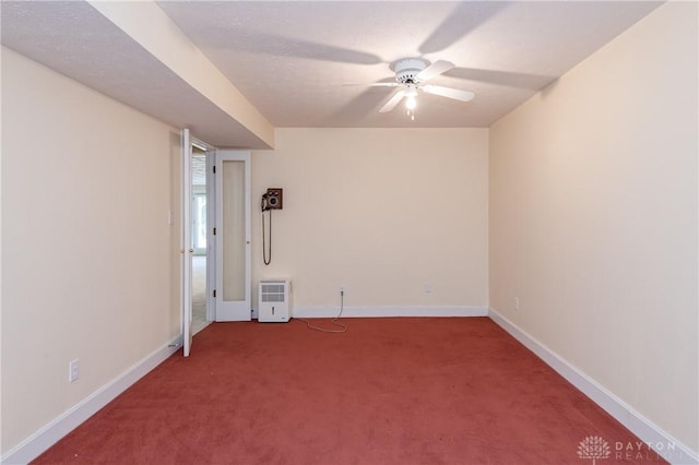 unfurnished room featuring carpet flooring, a ceiling fan, and baseboards