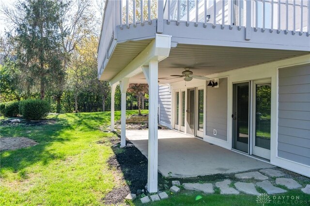 view of yard featuring a patio area and a ceiling fan