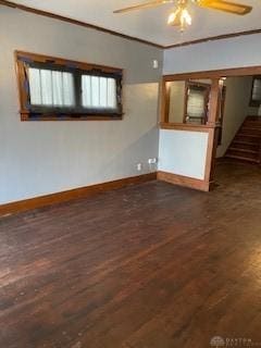 spare room with ceiling fan, dark hardwood / wood-style floors, and ornamental molding